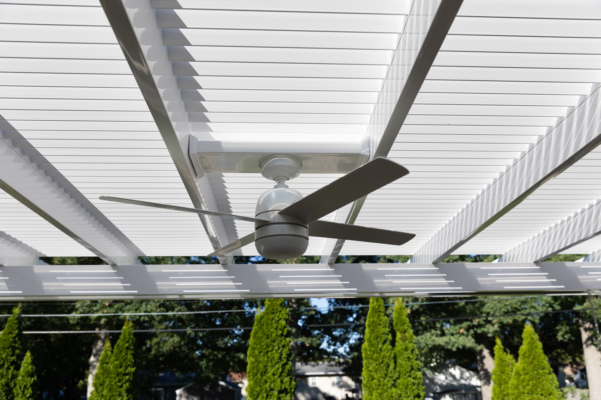 Close up photo of an outdoor fan installed on a heartland pergola